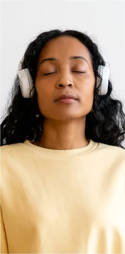 a woman listening to music during ketamine treatment